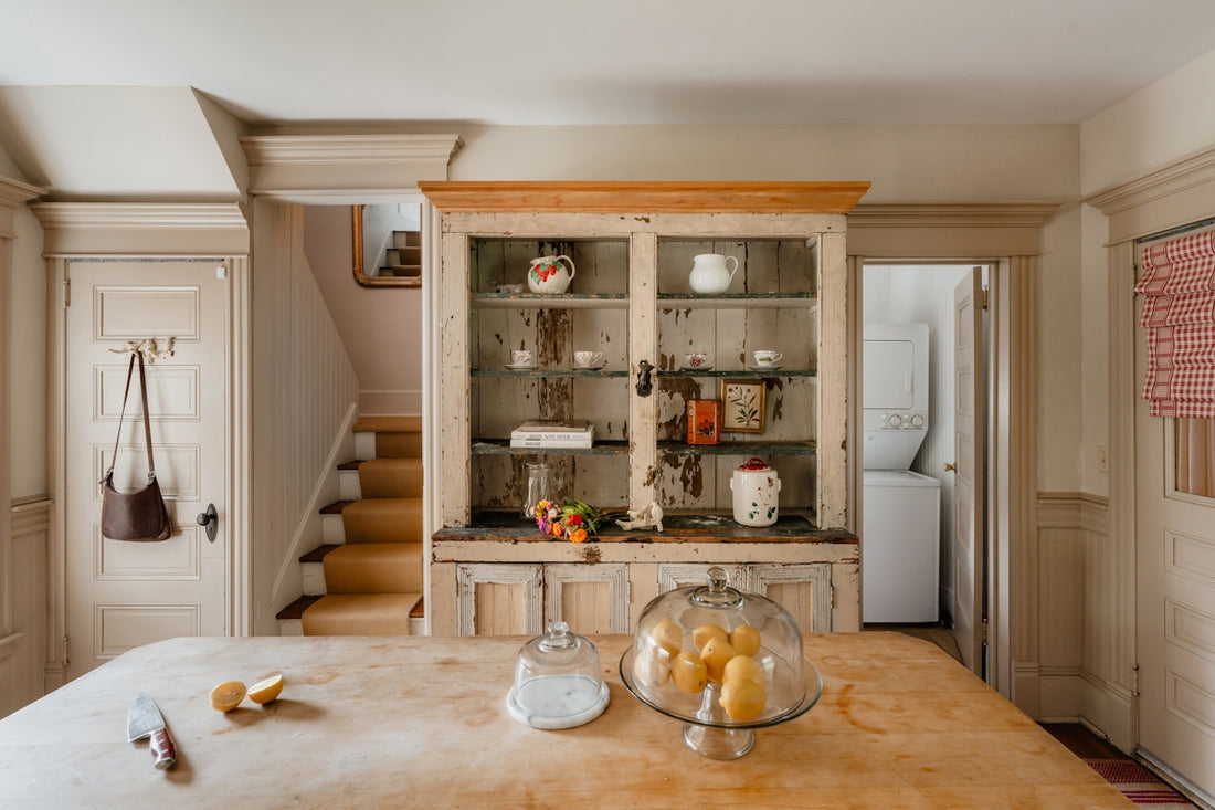 A rustic kitchen has a wooden cabinet