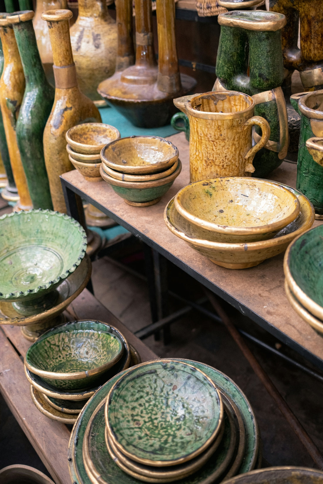 Assortment of rustic ceramic bowls and vases