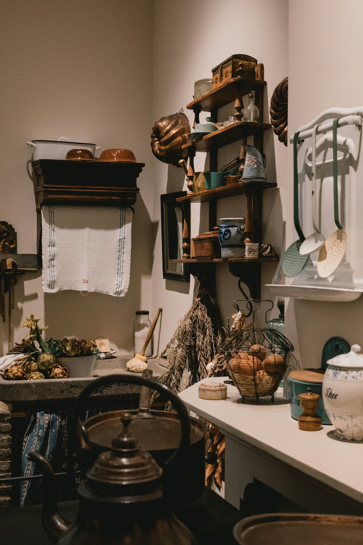 Antique kitchen with vintage cookware and utensils