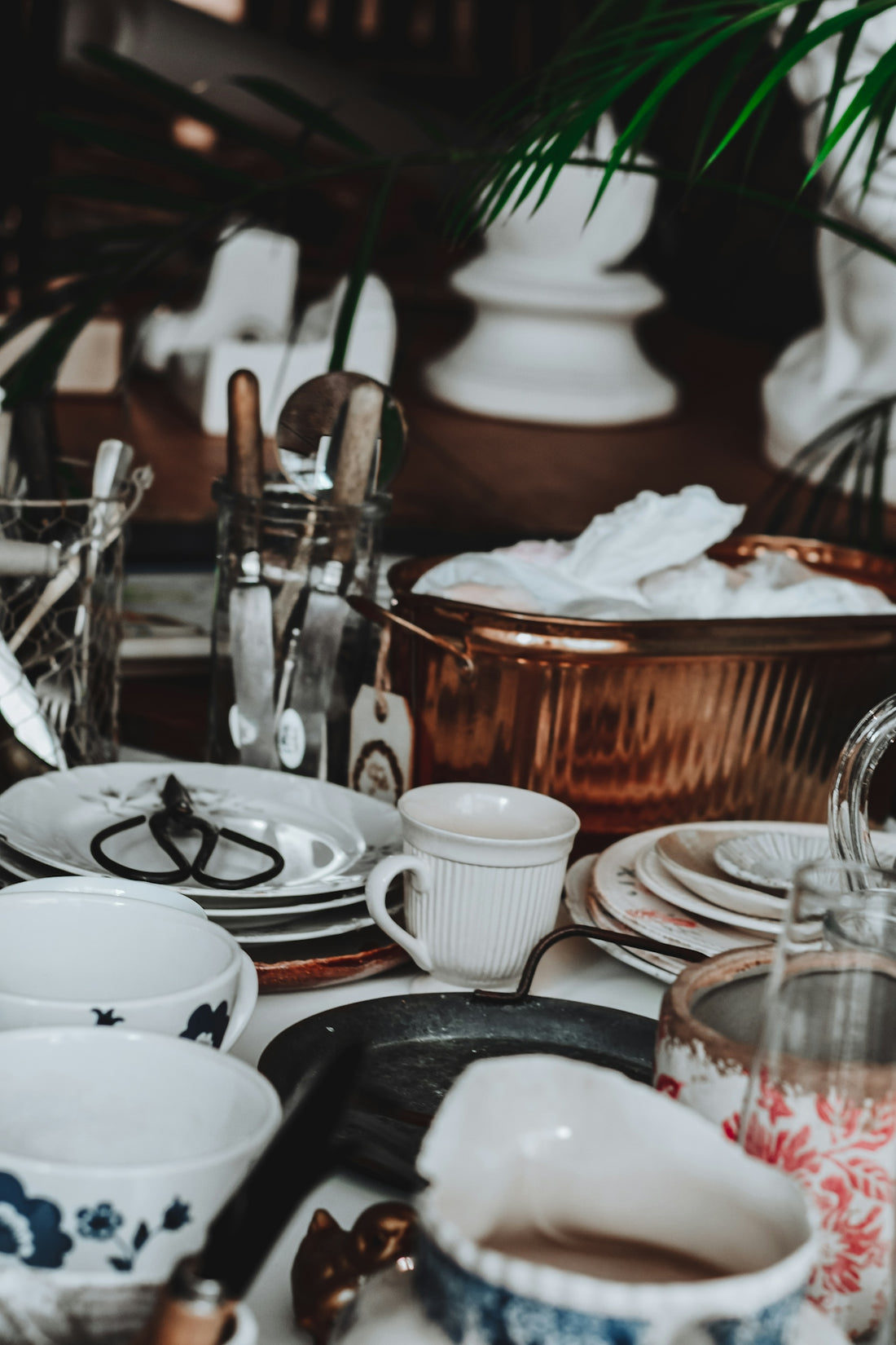 Assortment of vintage dishes and kitchenware on a table