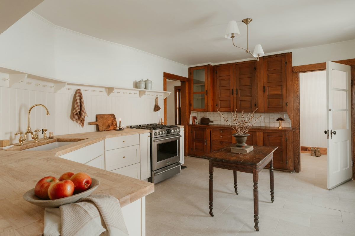 A rustic kitchen with wooden cabinets and a stove
