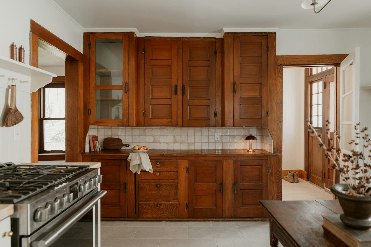 Vintage wooden kitchen cabinets with tiled backsplash