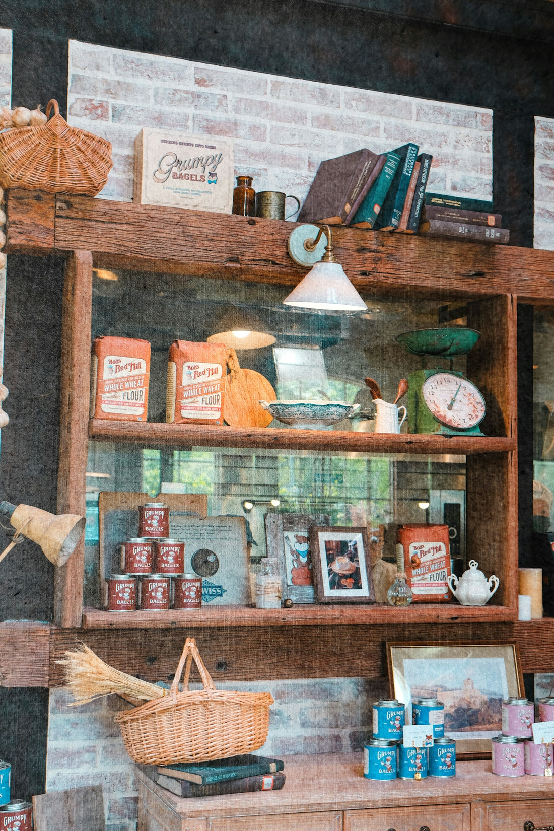 Rustic wooden shelves display vintage kitchen items and old books